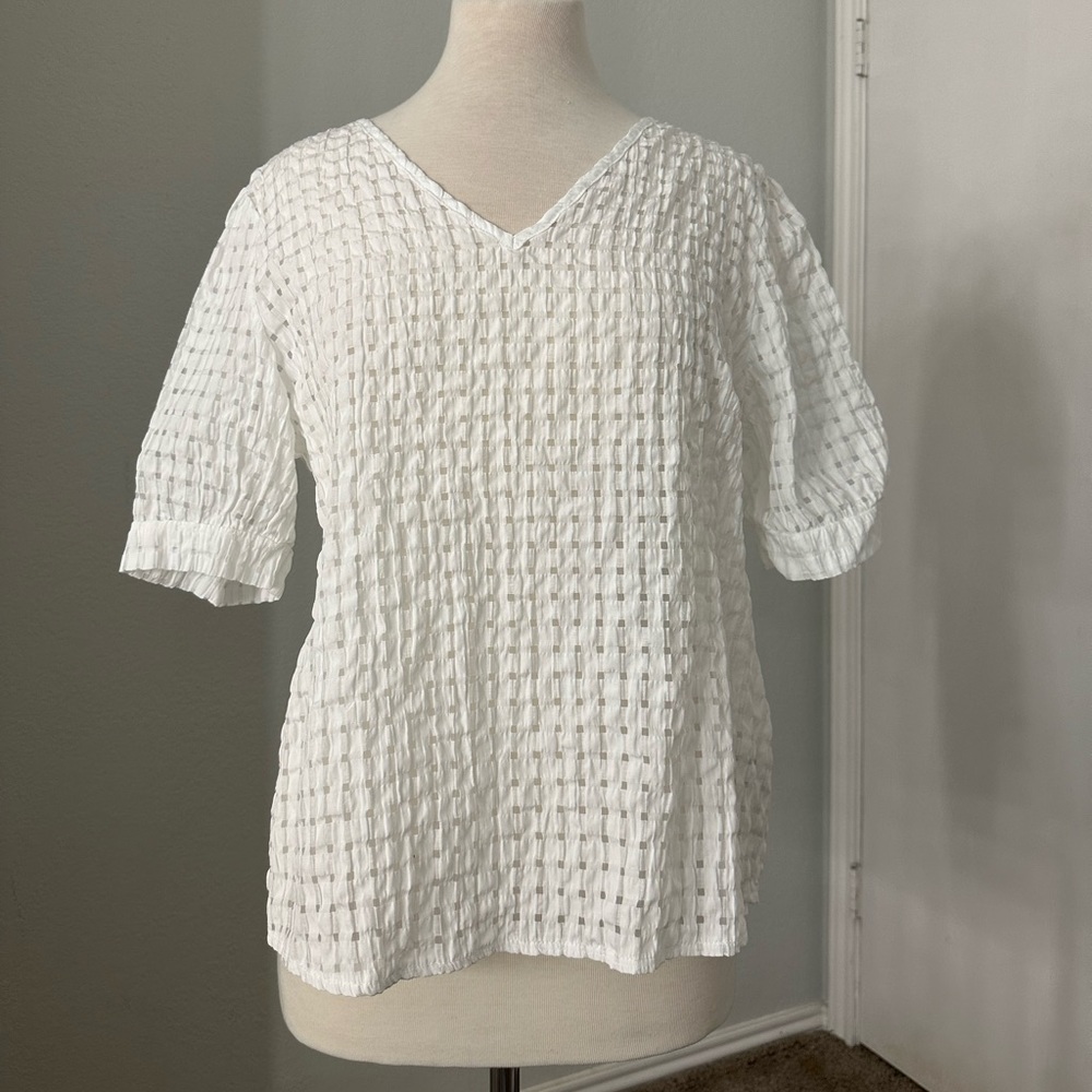 White gingham pattern blouse